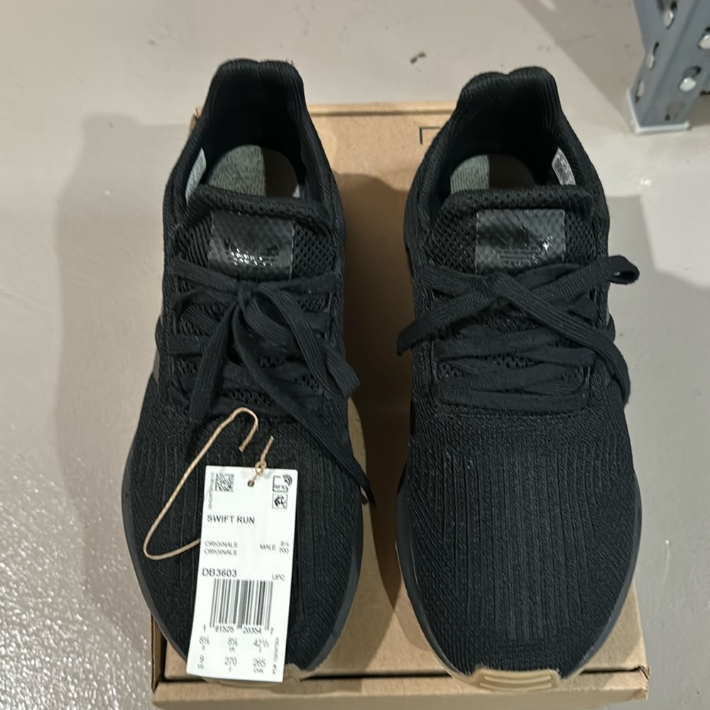 Adidas black tennis/running shoes Very popular “SwiftRun” style very gently worn